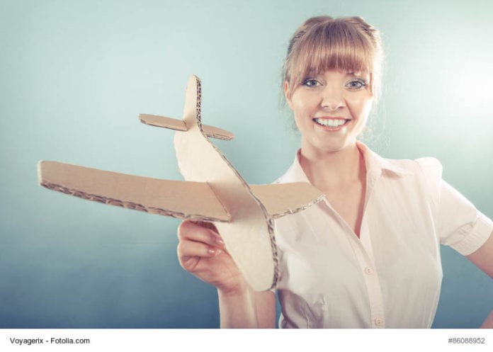 Lady holding plane image