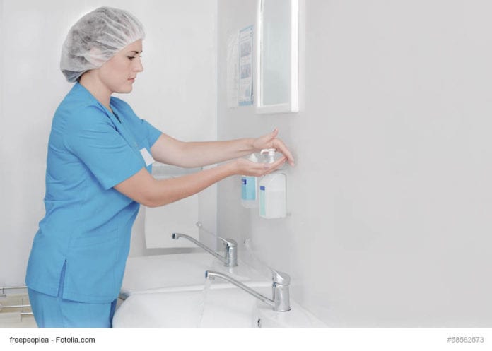 Nurse Cleaning Hands Image