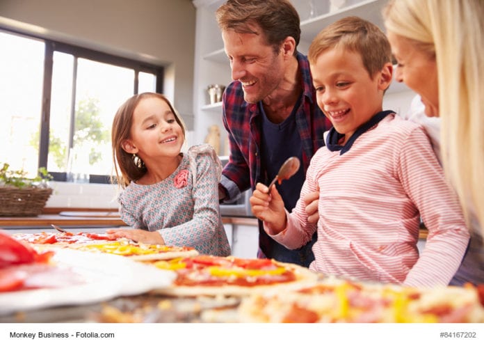 family making pizza image