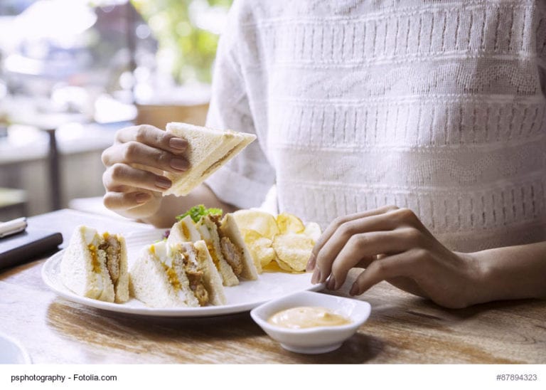 Woman Eating a Sandwich Image