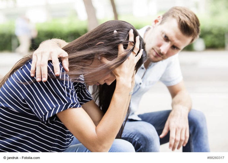 Man Comforting Wife Image