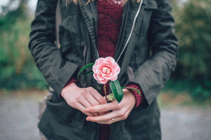 Girl Holding Flower Image