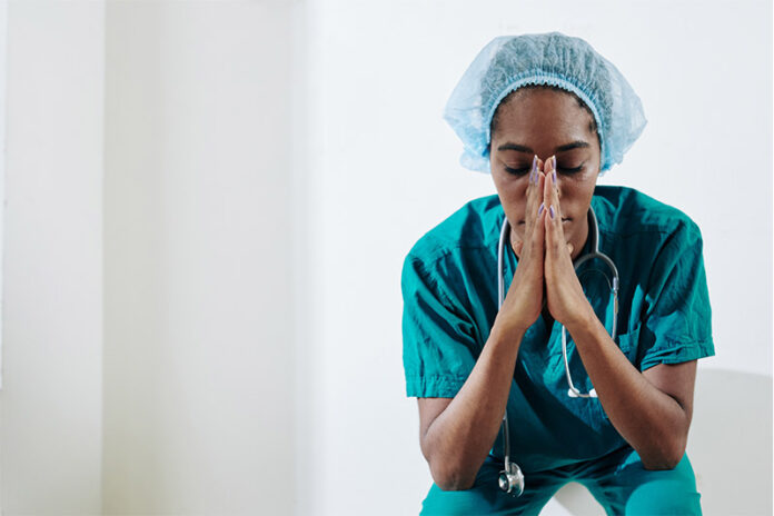 Exhausted nurse sitting