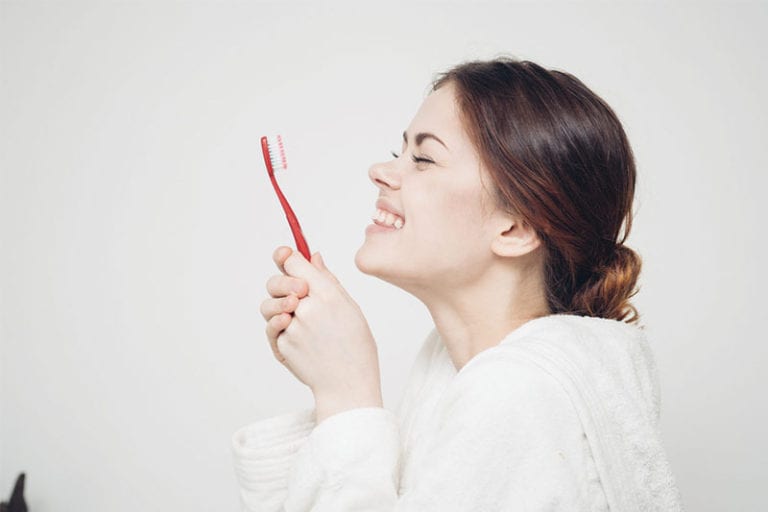 Woman_Smiling_In_The_Mirror_Image