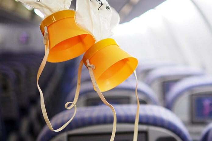 Two hanging oxygen masks on a plane