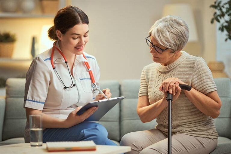 Female nurse in scrubs addressing patient healthcare