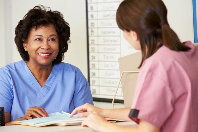 Two female nurses working in a medical office